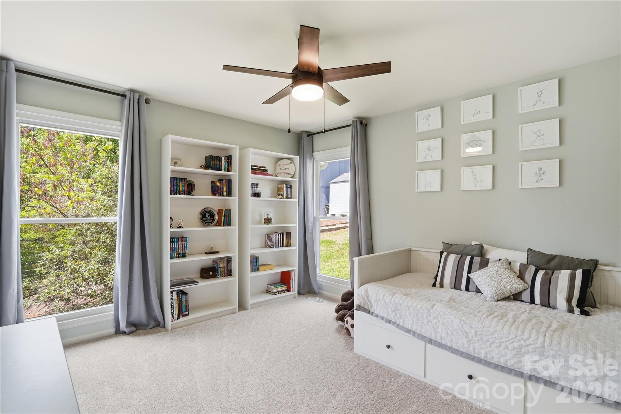 19011 Kailua Circle Tega Cay, SC 29708 - Photo 25 of 48 a bedroom with a bed and a large window