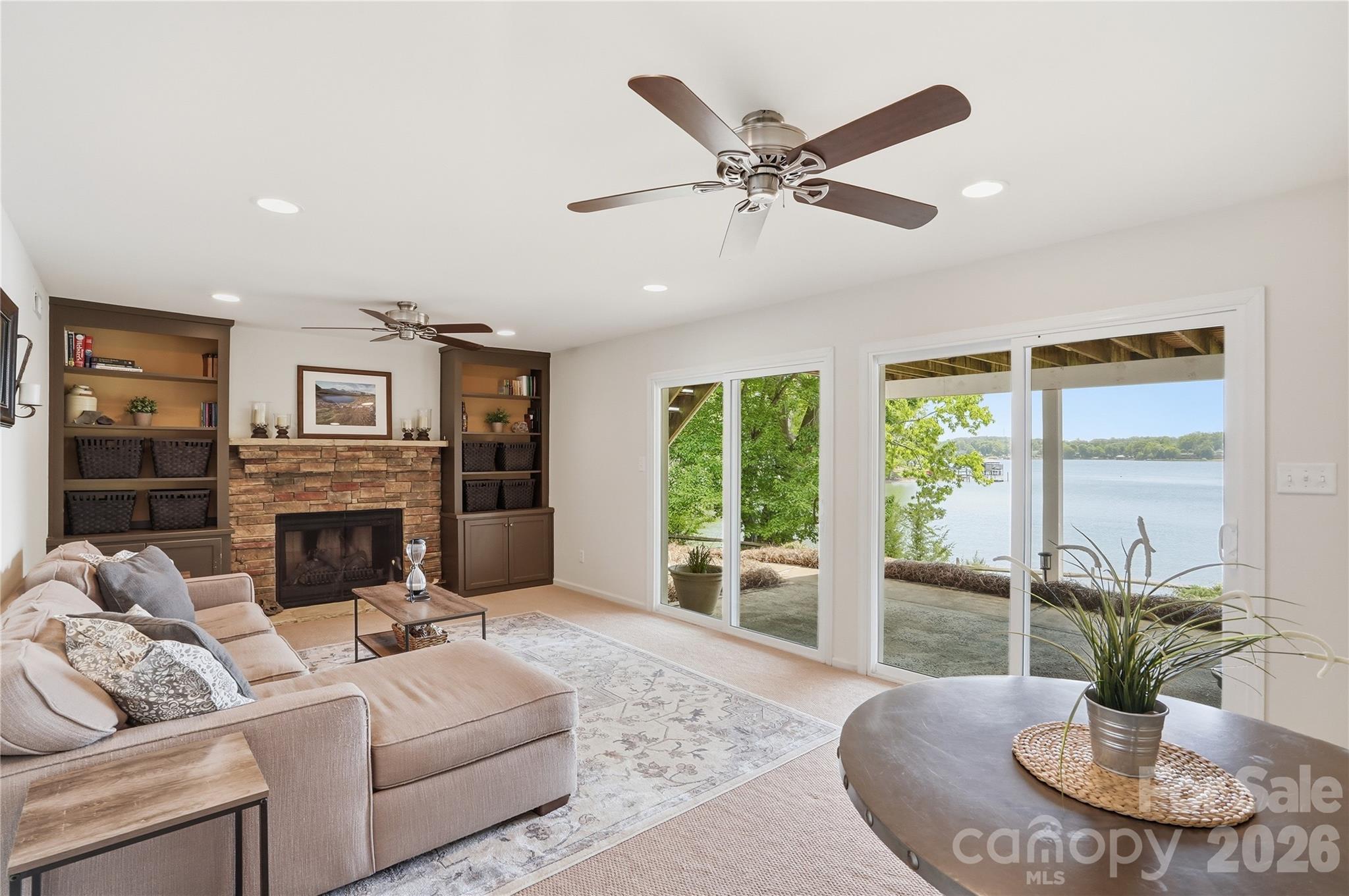 19011 Kailua Circle Tega Cay, SC 29708 - Photo 28 of 48 a living room with furniture a fireplace and a flat screen tv