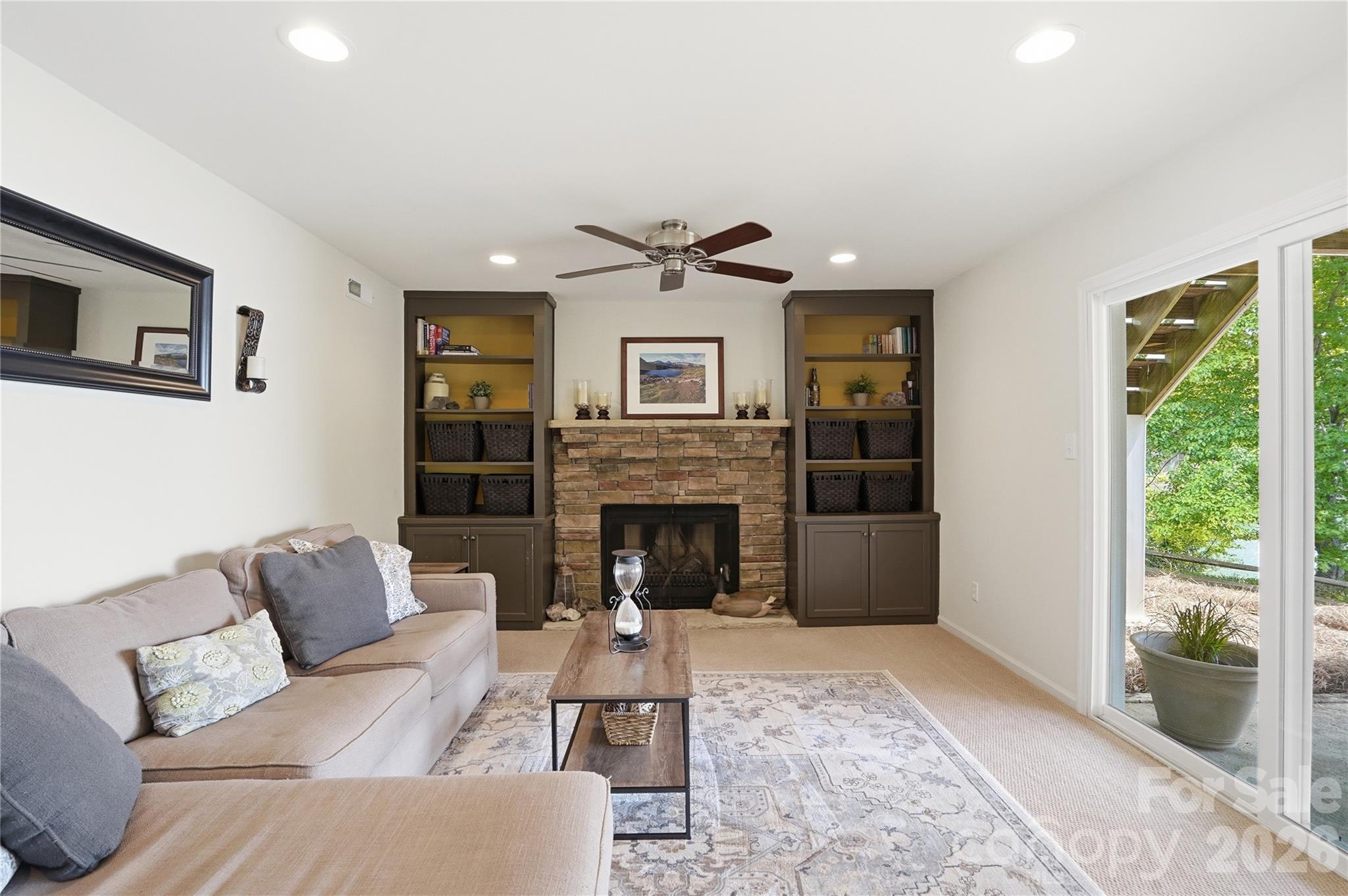 19011 Kailua Circle Tega Cay, SC 29708 - Photo 29 of 48 a living room with furniture and a fireplace