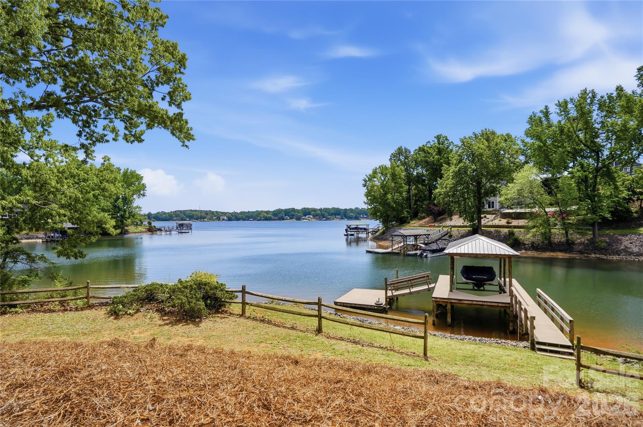 19011 Kailua Circle Tega Cay, SC 29708 - Photo 37 of 48 a lake with a bench and lake view