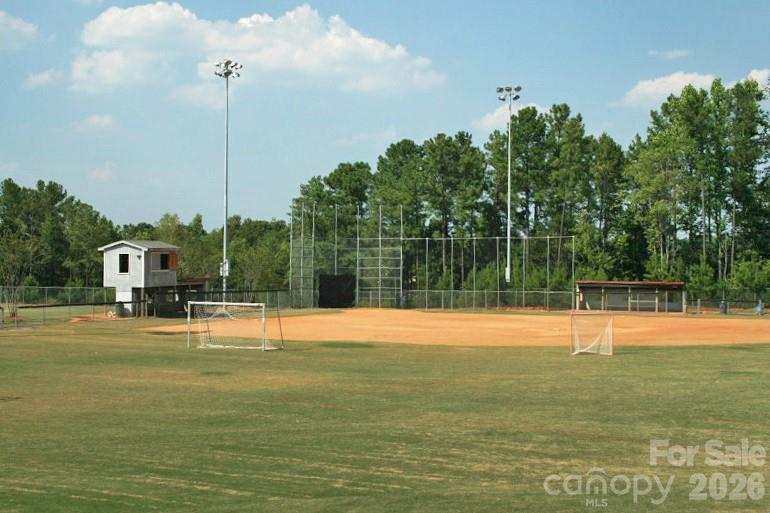 19011 Kailua Circle Tega Cay, SC 29708 - Photo 46 of 48 a view of a swimming pool with a yard and trees