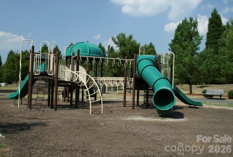 19011 Kailua Circle Tega Cay, SC 29708 - Photo 47 of 48 a backyard of a house with barbeque oven table and chairs