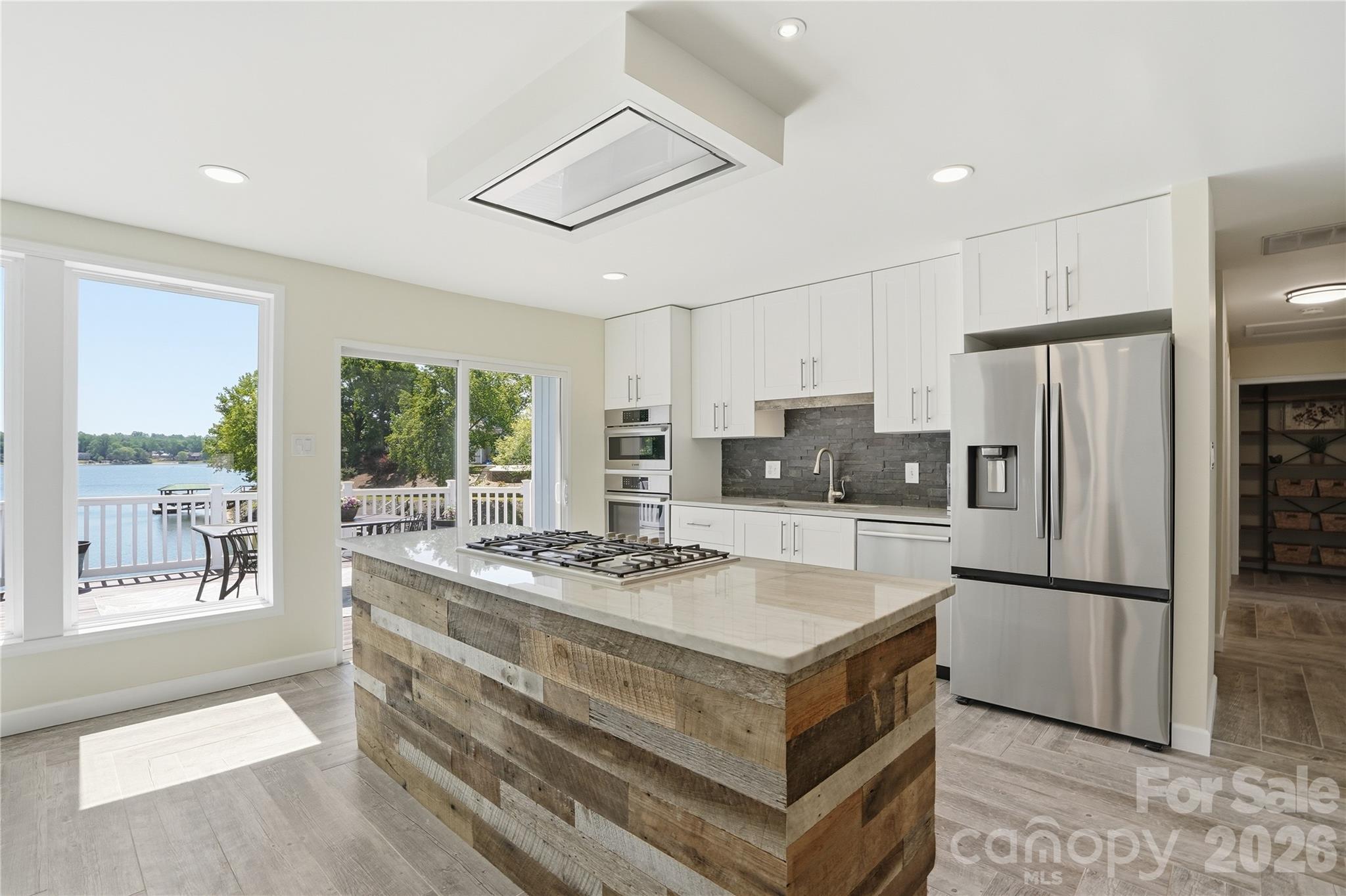 19011 Kailua Circle Tega Cay, SC 29708 - Photo 9 of 48 a kitchen with a stove a refrigerator and a sink