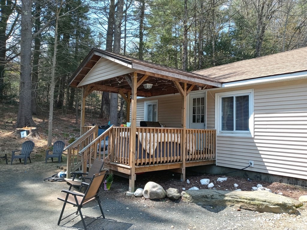 44 Littleville Road Huntington, MA 01050 - Photo 3 of 29 a view of a house with a wooden deck and a trees