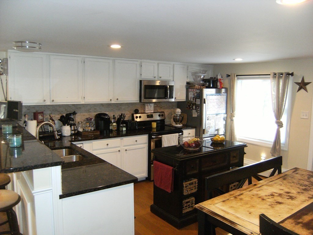 44 Littleville Road Huntington, MA 01050 - Photo 6 of 29 a kitchen with a sink stove and refrigerator