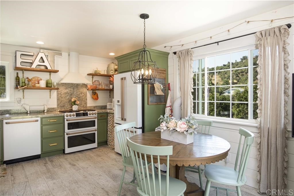 3945 Pala Mesa Drive Fallbrook, CA 92028 - Photo 19 of 23 a view of a dining room with furniture window and wooden floor