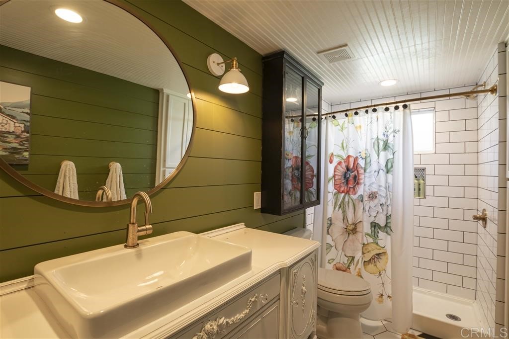 3945 Pala Mesa Drive Fallbrook, CA 92028 - Photo 20 of 23 a bathroom with a sink toilet and shower