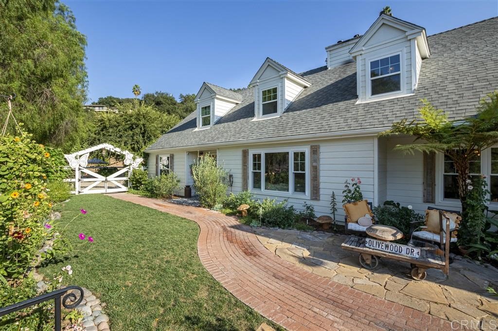 3945 Pala Mesa Drive Fallbrook, CA 92028 - Photo 2 of 23 a front view of a house with garden