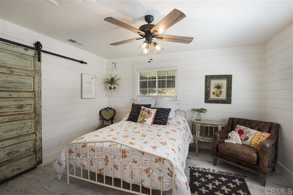 3945 Pala Mesa Drive Fallbrook, CA 92028 - Photo 21 of 23 a bedroom with a bed and a couch