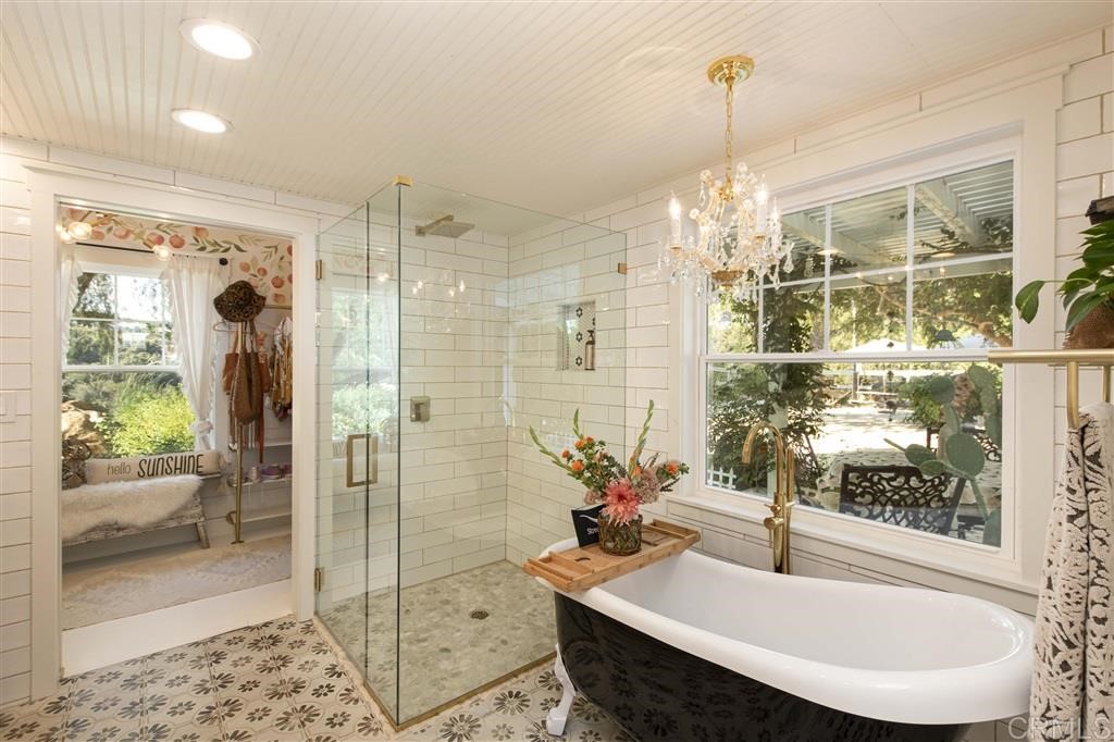 3945 Pala Mesa Drive Fallbrook, CA 92028 - Photo 9 of 23 a dining room with furniture and a chandelier