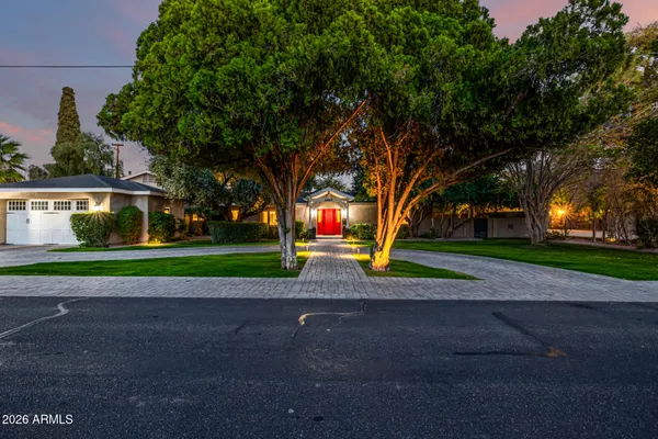 a front view of a house with garden