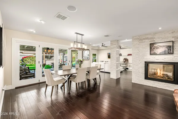a view of a dining room with furniture window and wooden floor