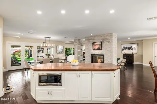 a bedroom with a bed a couch and a window