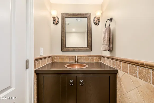 a bedroom with a bed couch and window