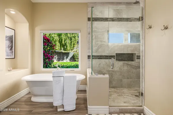 a bathroom with a sink vanity granite and a mirror