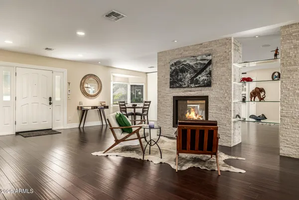 a living room with furniture and a large window