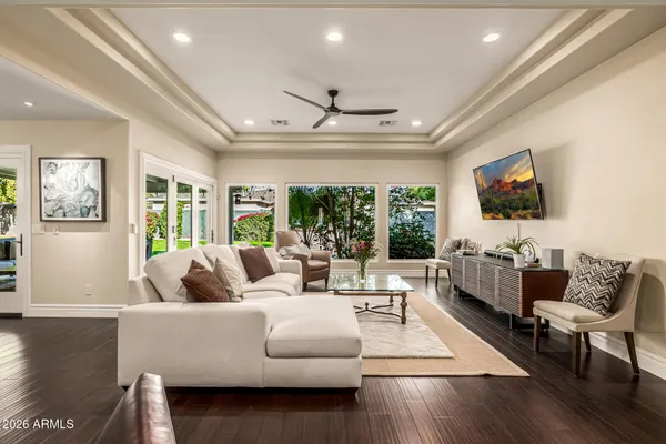 a view of a dining room with furniture and wooden floor