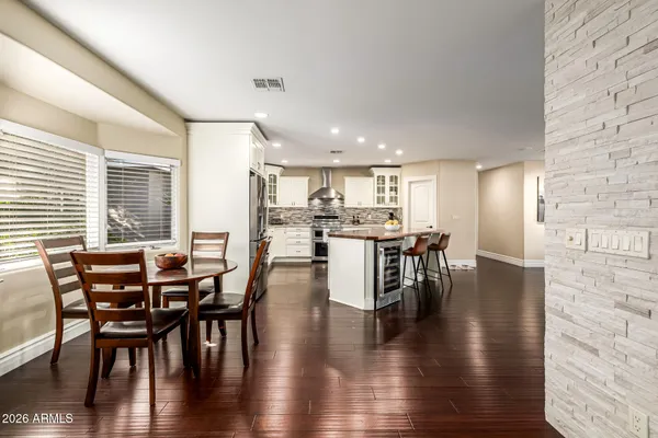 a view of a dining room with furniture window and wooden floor