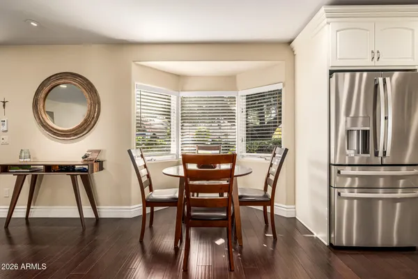a view of a dining room with furniture window and wooden floor