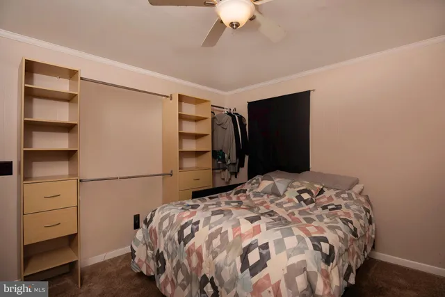 a bedroom with a bed and a closet