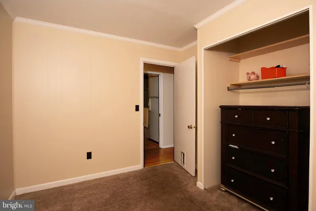 a view of a hallway with closet