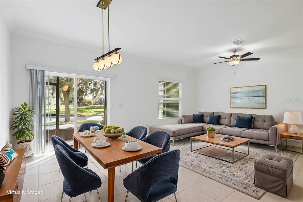 13755 Big Hawk Way Lithia, FL 33547 - Photo 13 of 33 a living room with furniture a chandelier and a window