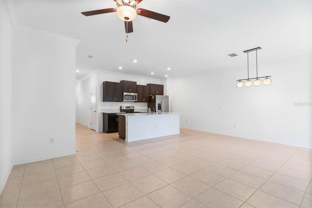 13755 Big Hawk Way Lithia, FL 33547 - Photo 16 of 33 a view of kitchen and living room