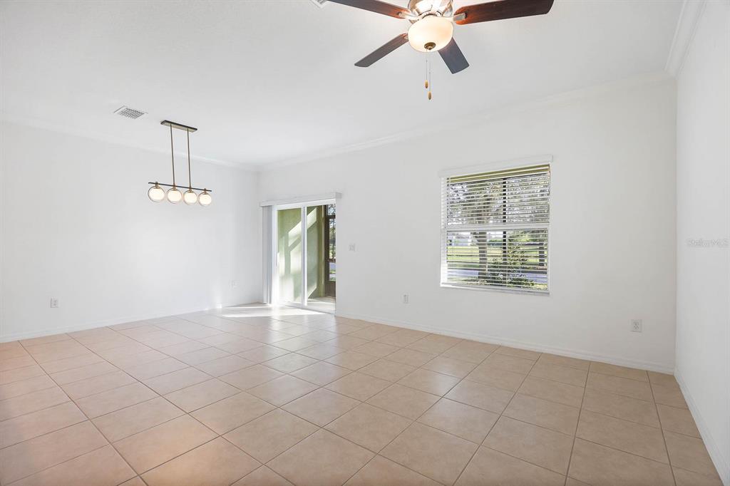13755 Big Hawk Way Lithia, FL 33547 - Photo 17 of 33 a view of an empty room with a window