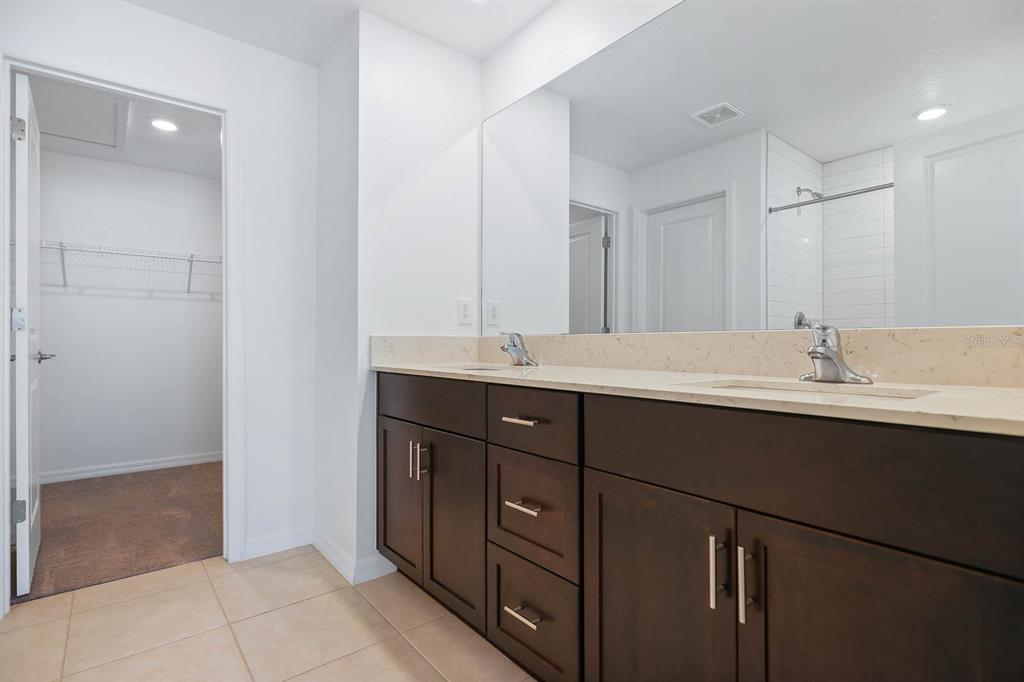 13755 Big Hawk Way Lithia, FL 33547 - Photo 23 of 33 a bathroom with a sink and a mirror