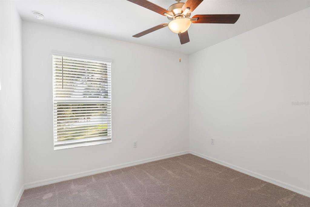 13755 Big Hawk Way Lithia, FL 33547 - Photo 25 of 33 an empty room with a window and a fan