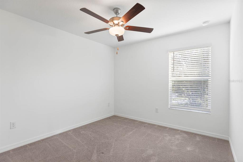 13755 Big Hawk Way Lithia, FL 33547 - Photo 28 of 33 a view of an empty room with a window