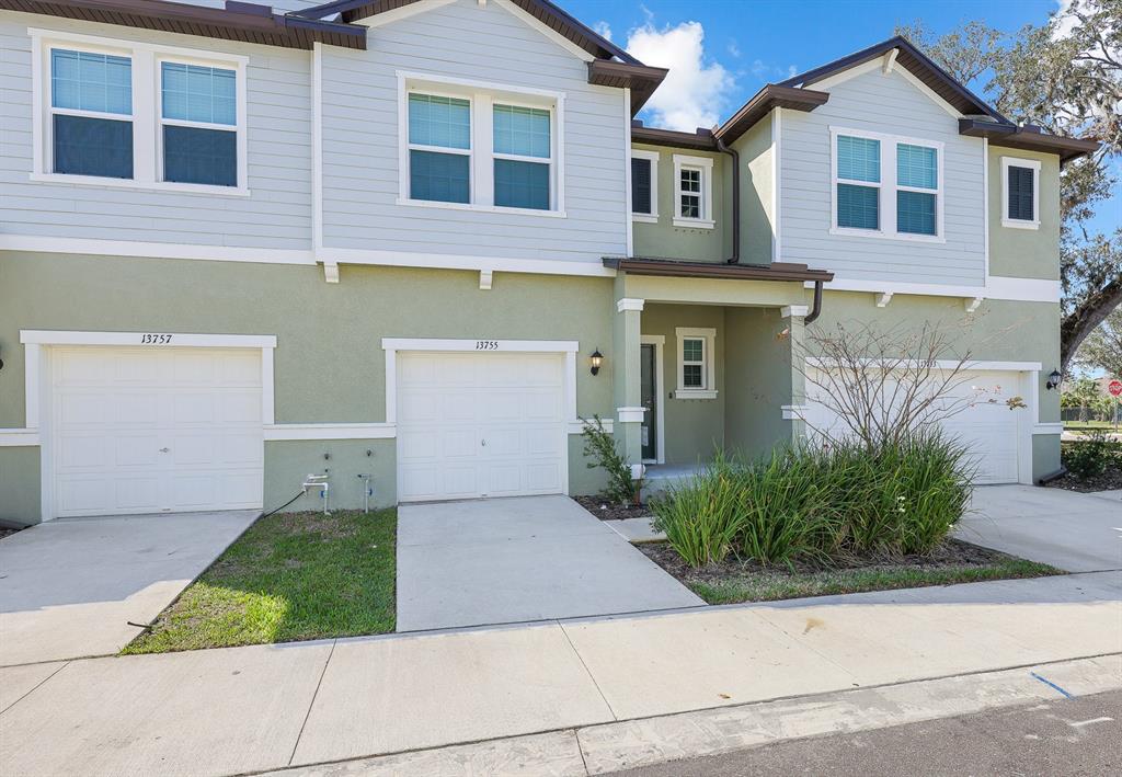 13755 Big Hawk Way Lithia, FL 33547 - Photo 32 of 33 a front view of a house with garden