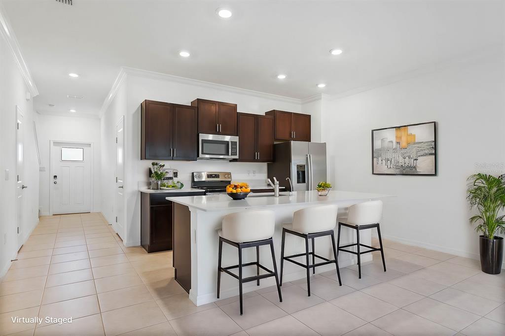 13755 Big Hawk Way Lithia, FL 33547 - Photo 8 of 33 a kitchen with a sink cabinets and refrigerator