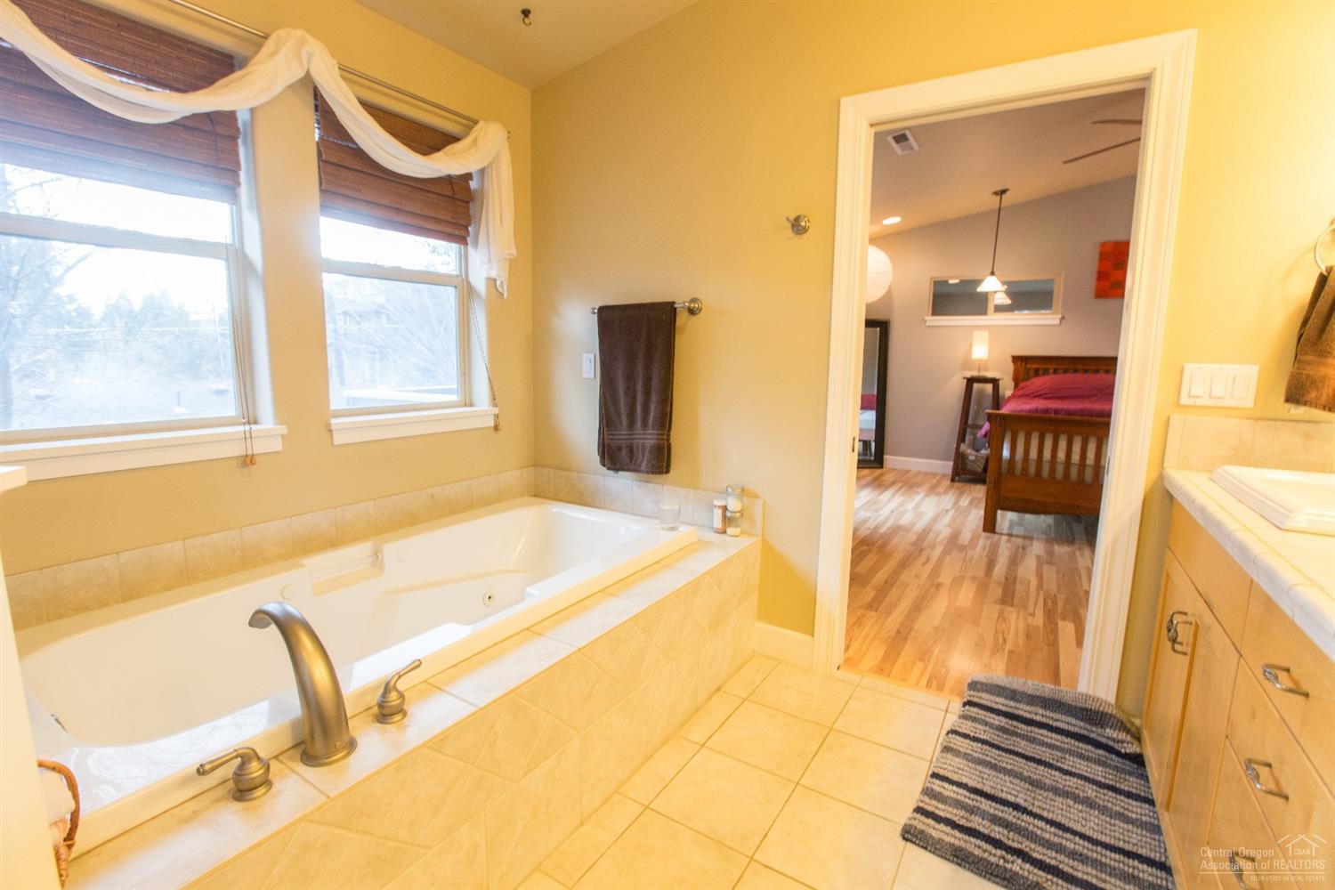 1920 Northwest Awbrey Road Bend, OR 97703 - Photo 14 of 18 a spacious bathroom with a tub and mirror