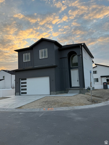352 East Mistilake Lane, Unit 20 Draper, UT 84020 - Photo 1 of 2 View of front facade featuring an attached garage, driveway, and board and batten siding