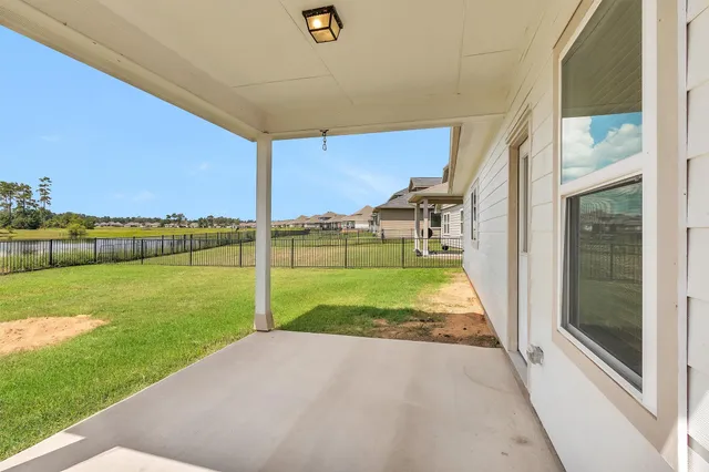 a view of a swimming pool with a yard