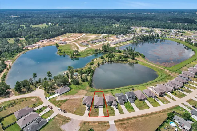 a view of a lake with a house in the background