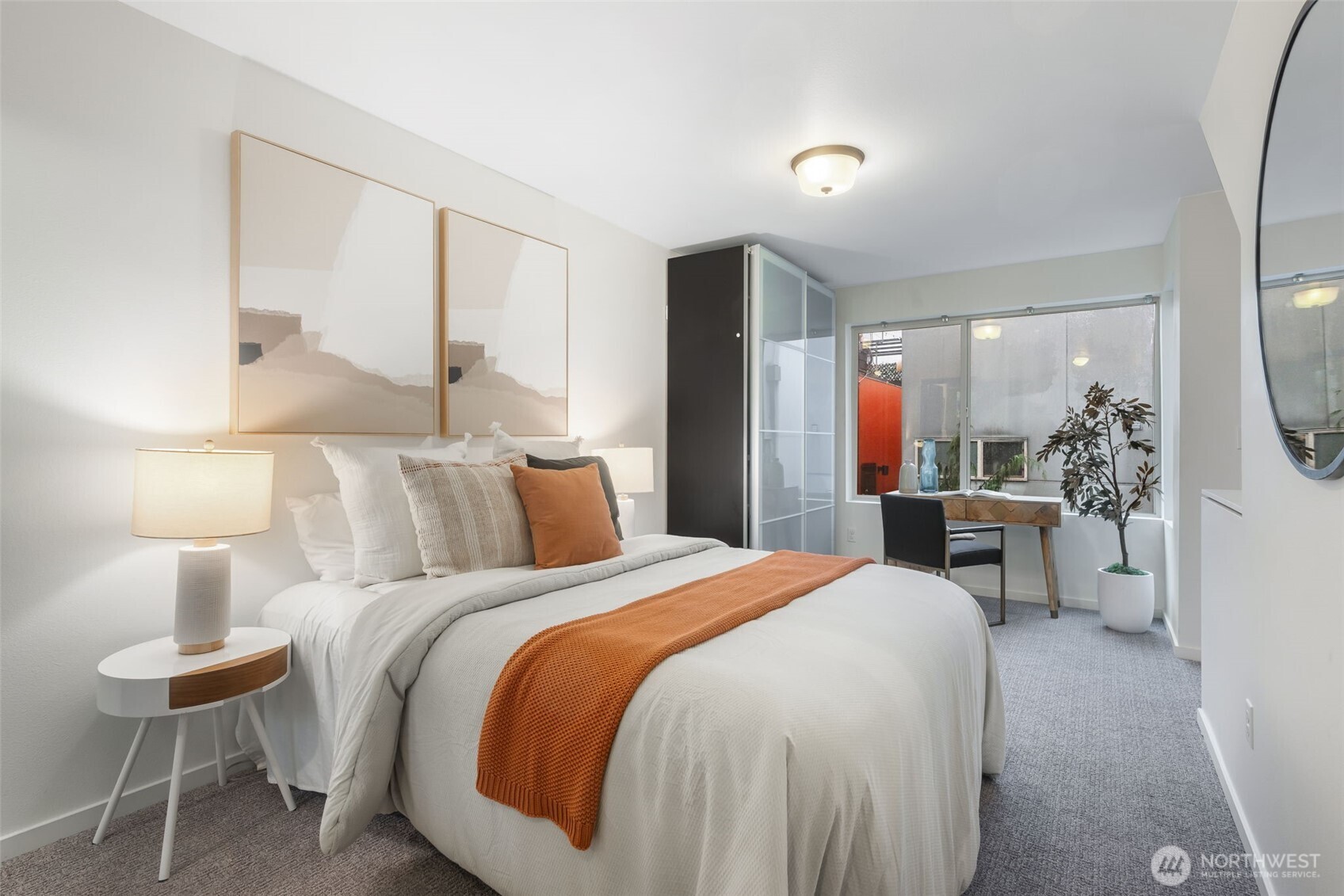 7758 Delridge Way Southwest Seattle, WA 98106 - Photo 11 of 22 a bedroom with a bed and a mirror