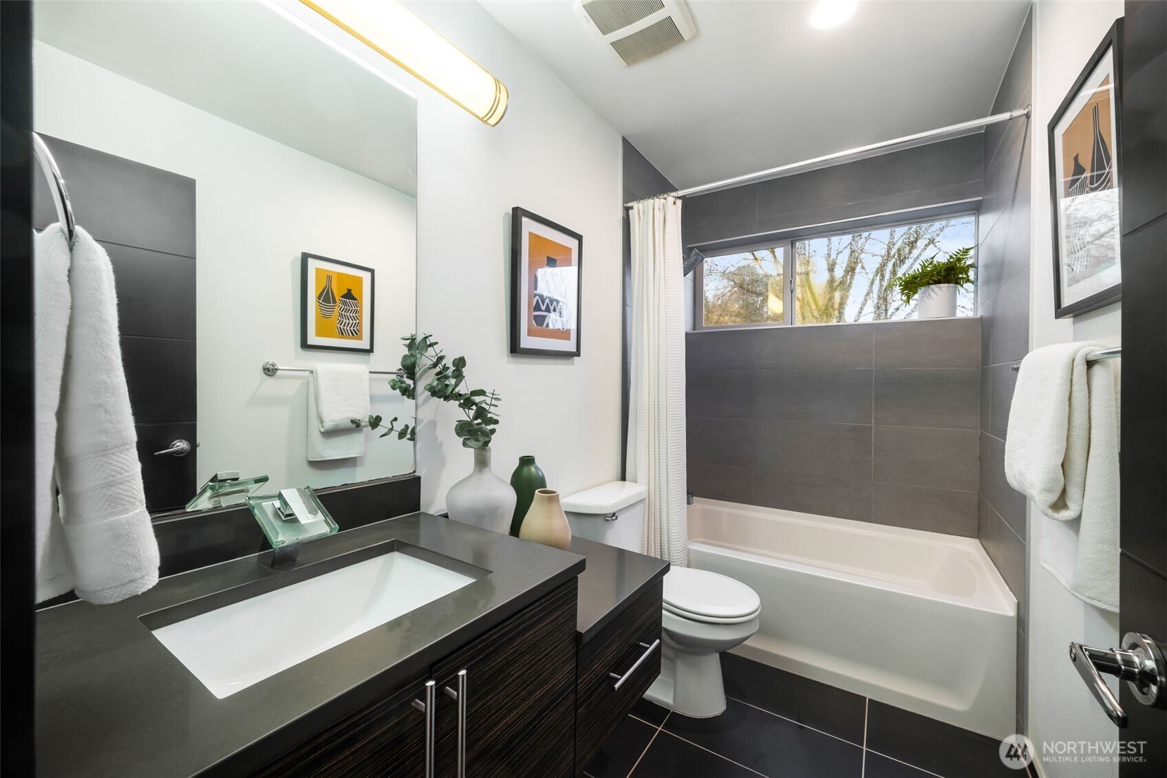 7758 Delridge Way Southwest Seattle, WA 98106 - Photo 13 of 22 a bathroom with a sink a toilet and a bathtub