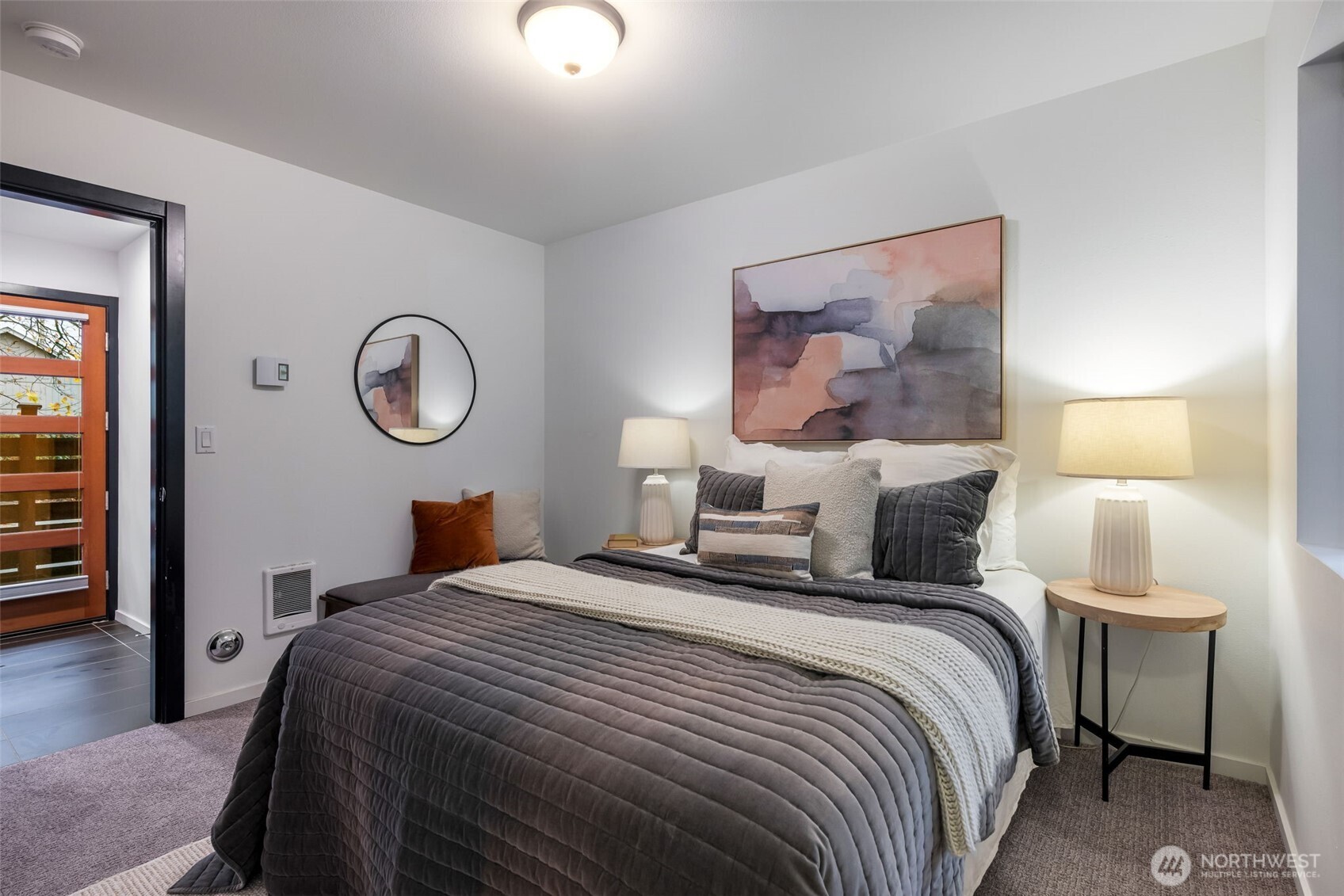 7758 Delridge Way Southwest Seattle, WA 98106 - Photo 15 of 22 a bedroom with a bed and a painting on the wall