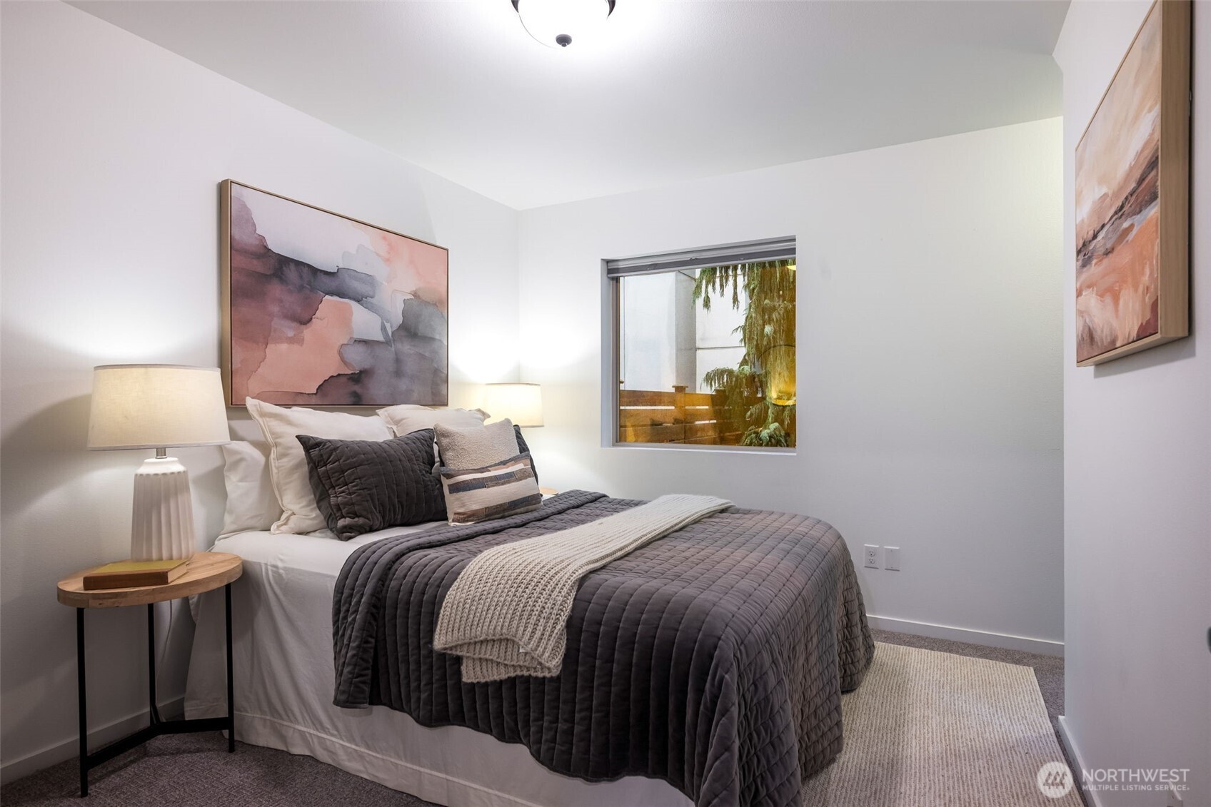 7758 Delridge Way Southwest Seattle, WA 98106 - Photo 16 of 22 a bedroom with a bed and a painting on the wall