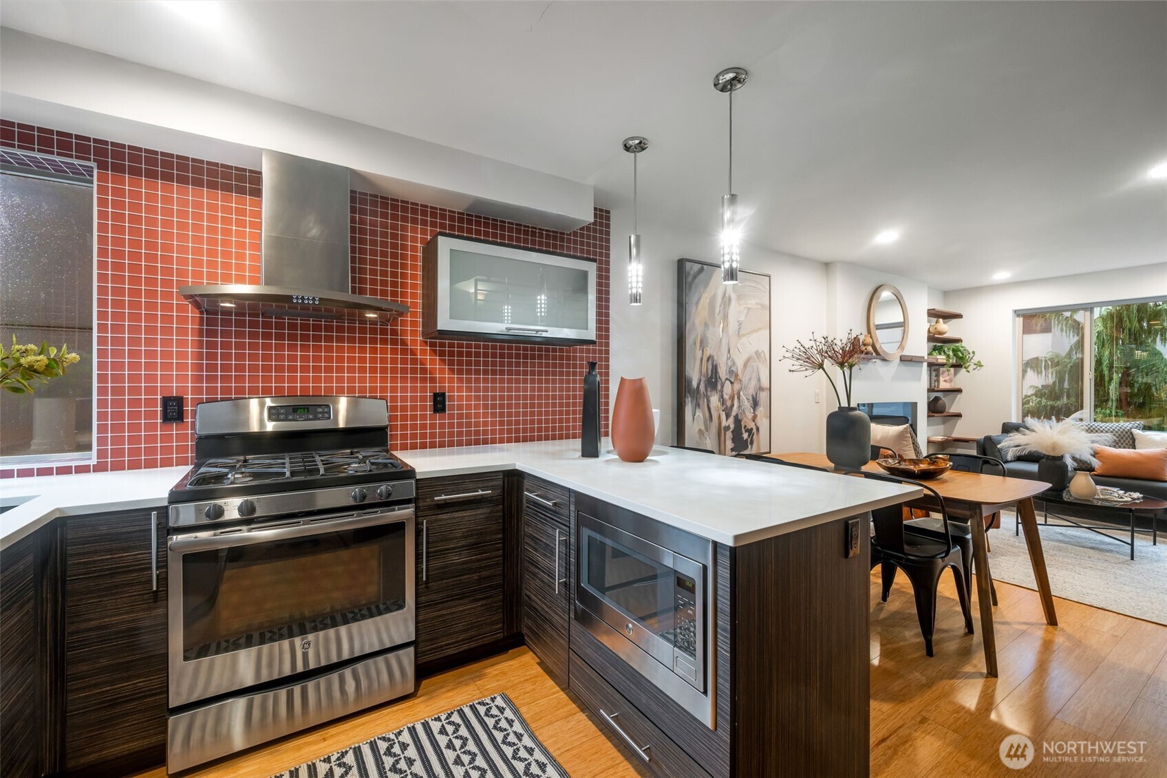 7758 Delridge Way Southwest Seattle, WA 98106 - Photo 9 of 22 a kitchen with a stove and a sink