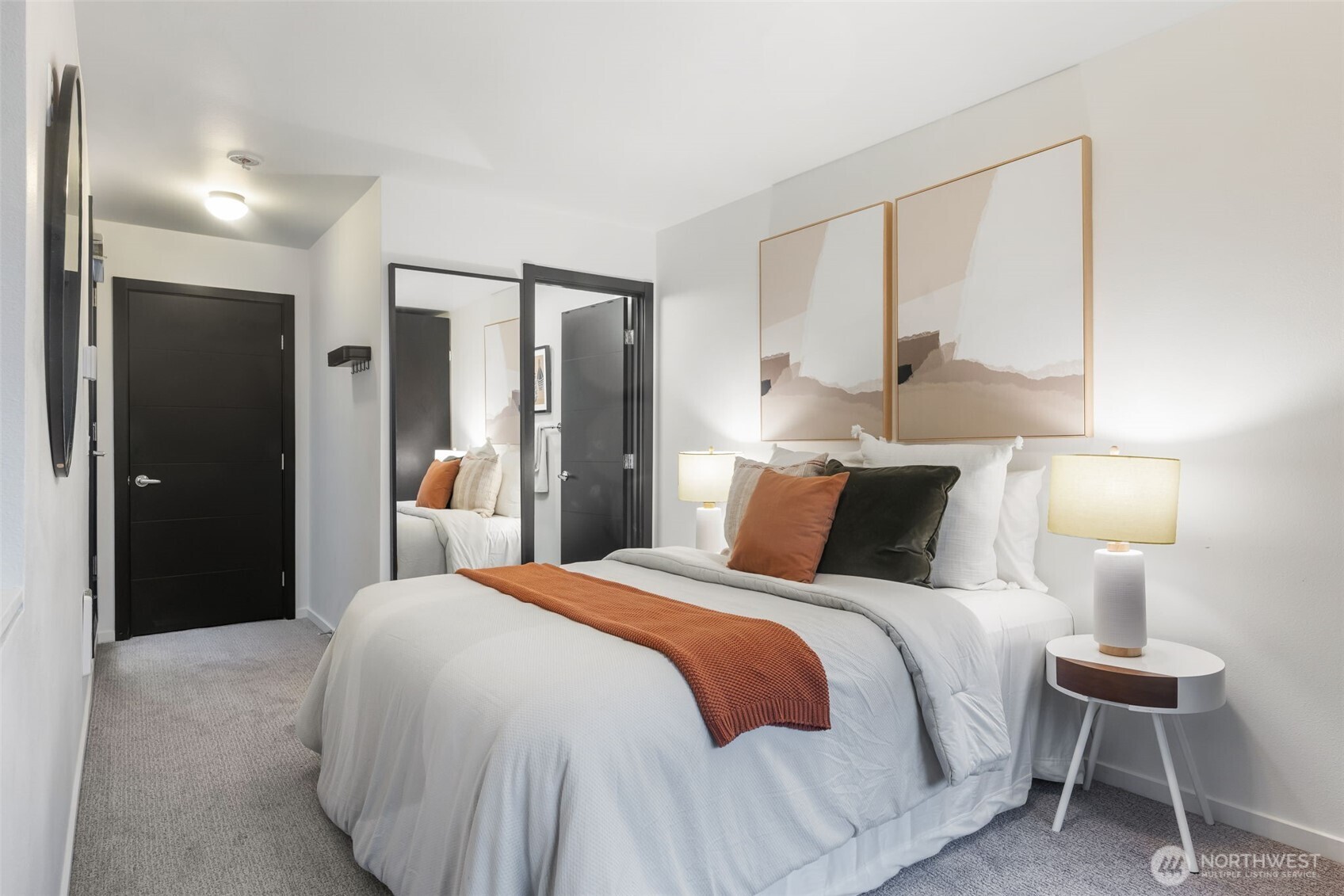 7758 Delridge Way Southwest Seattle, WA 98106 - Photo 10 of 22 a bedroom with a bed and a lamp