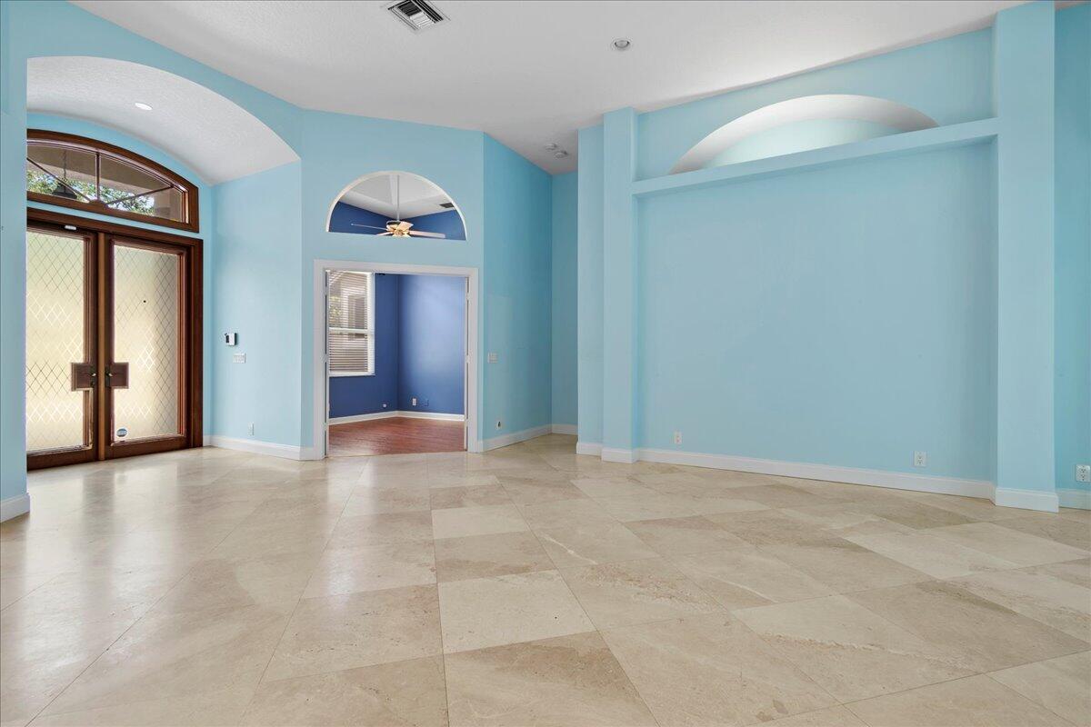 6989 Cypress Cove Circle Jupiter, FL 33458 - Photo 12 of 47 a view of a hallway with windows