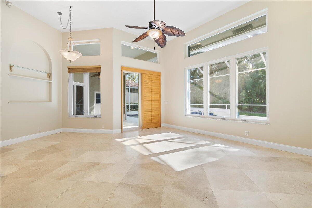 6989 Cypress Cove Circle Jupiter, FL 33458 - Photo 19 of 47 a view of an empty room with a window