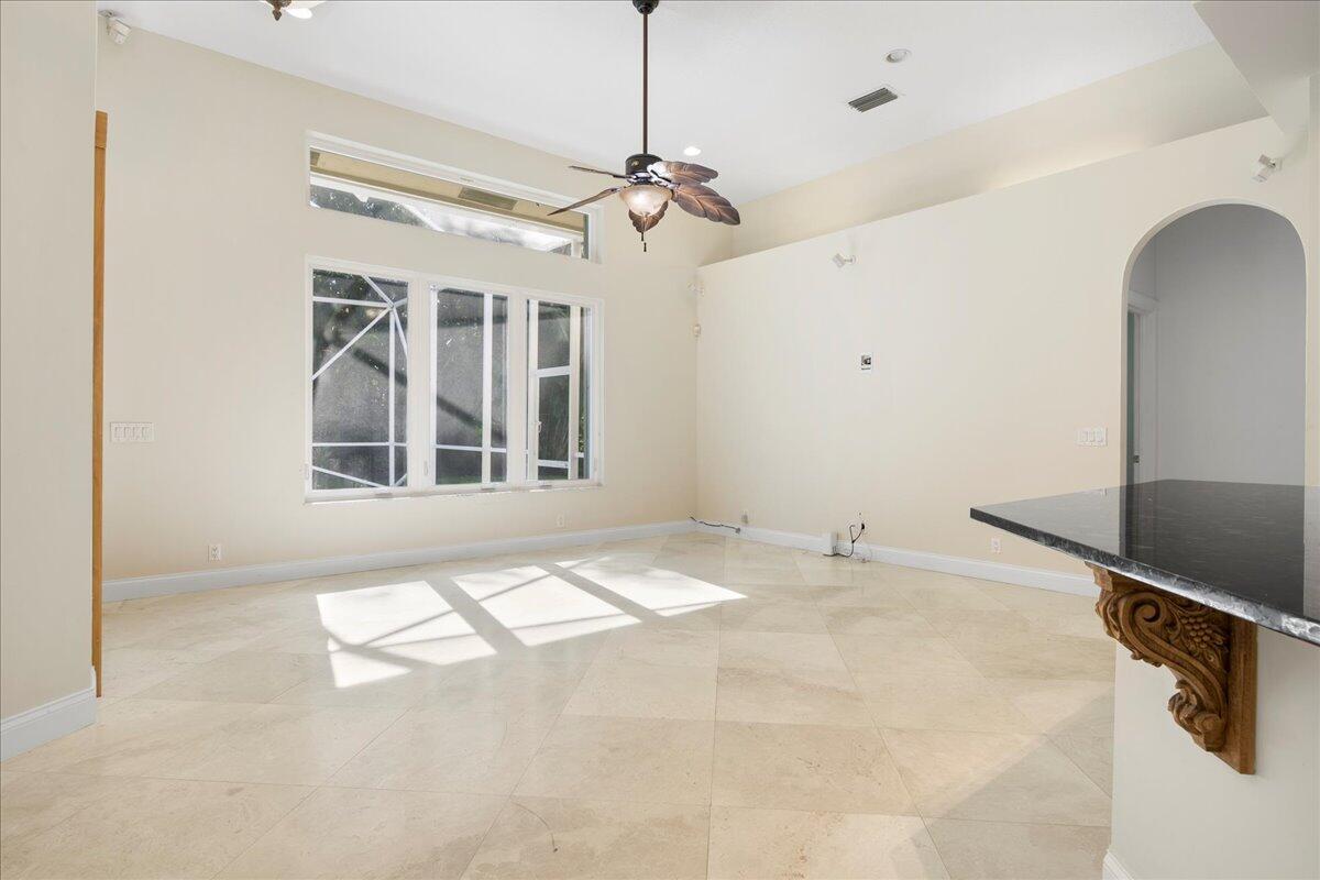 6989 Cypress Cove Circle Jupiter, FL 33458 - Photo 20 of 47 a view of an empty room with a window