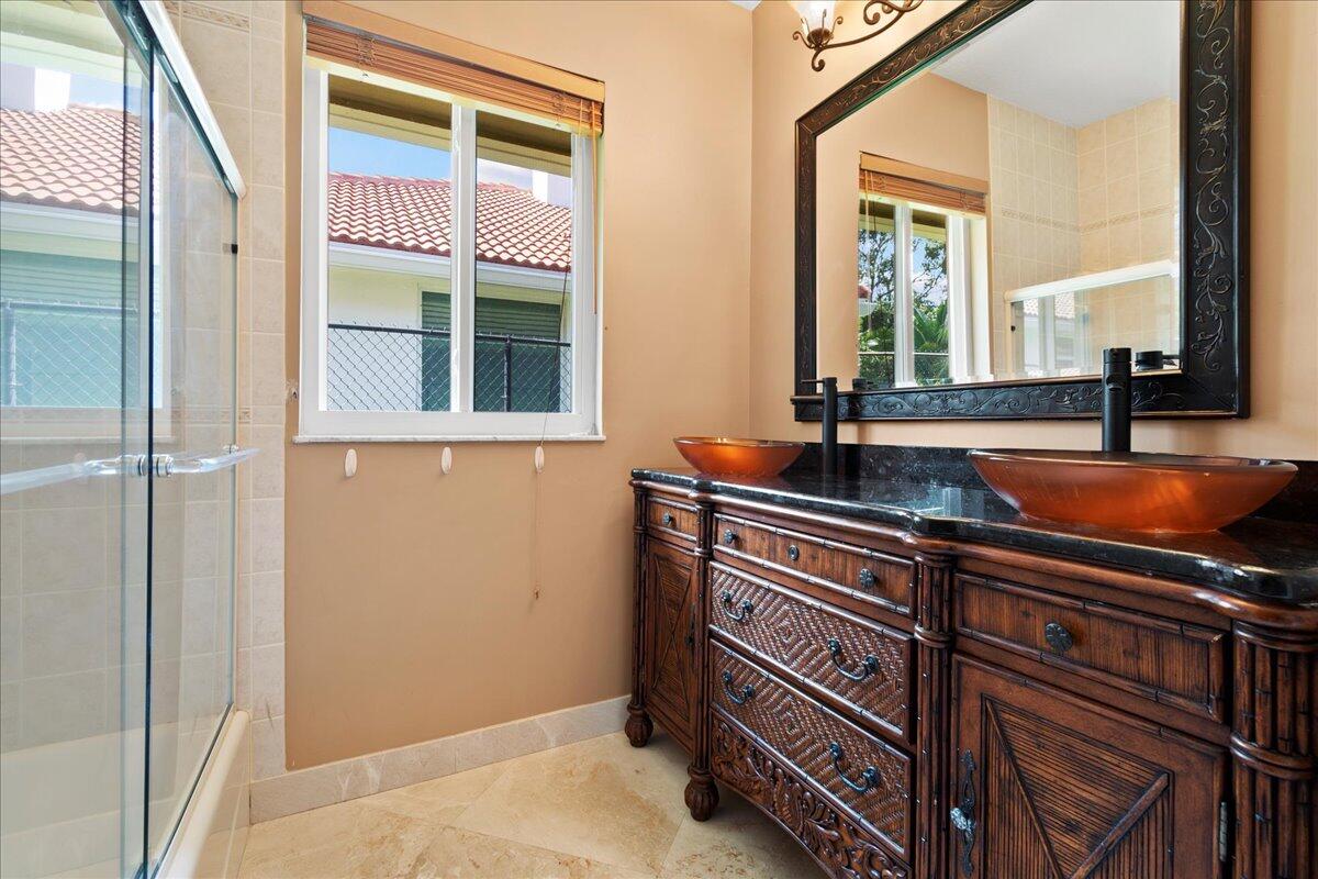 6989 Cypress Cove Circle Jupiter, FL 33458 - Photo 31 of 47 a blue bench sitting in front of a window