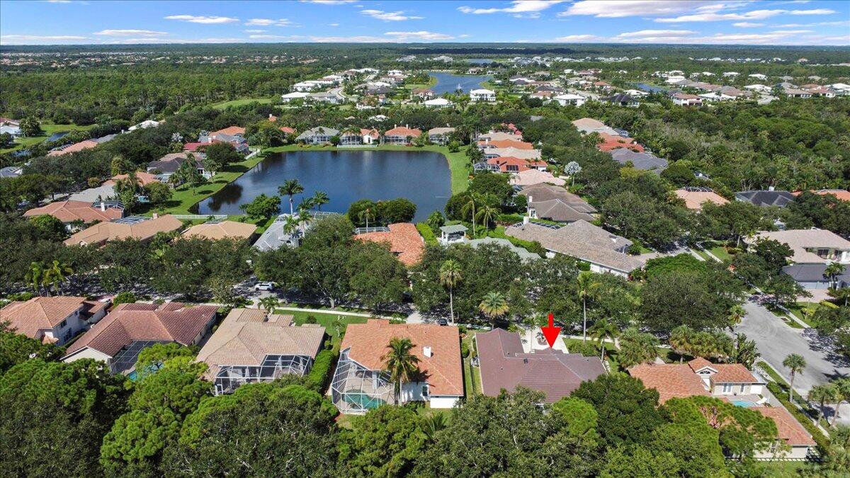 6989 Cypress Cove Circle Jupiter, FL 33458 - Photo 44 of 47 an aerial view of a city with lots of residential buildings ocean and mountain view in back