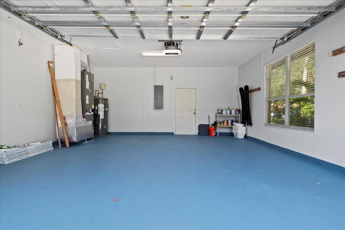 6989 Cypress Cove Circle Jupiter, FL 33458 - Photo 9 of 47 a view of a room with gym equipment