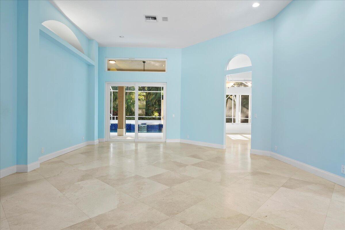 6989 Cypress Cove Circle Jupiter, FL 33458 - Photo 10 of 47 an empty room with windows and closet